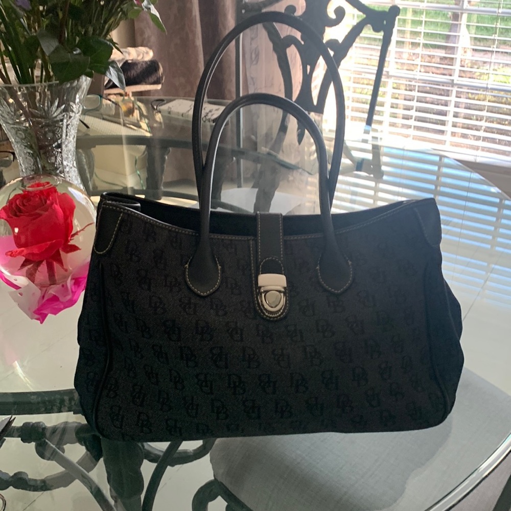 Like new authentic Dooney Burke lots of space and very clean
